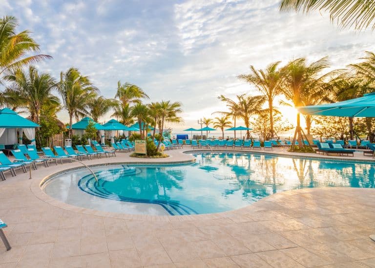 The Lone Palm pool at Margaritaville Beach Resort at sunset